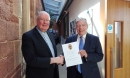 Congratulations to Ian Aitken as he receives a Certificate from Revd. David to mark his 40 years service as an elder .